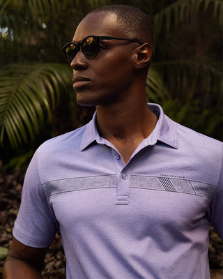 Ukulele Sunrise Polo for men by Travis Mathew – heathered Pima cotton/poly blend mens polo t-shirt with angled chest stripe and built-in collar stays for casual or golf wear.